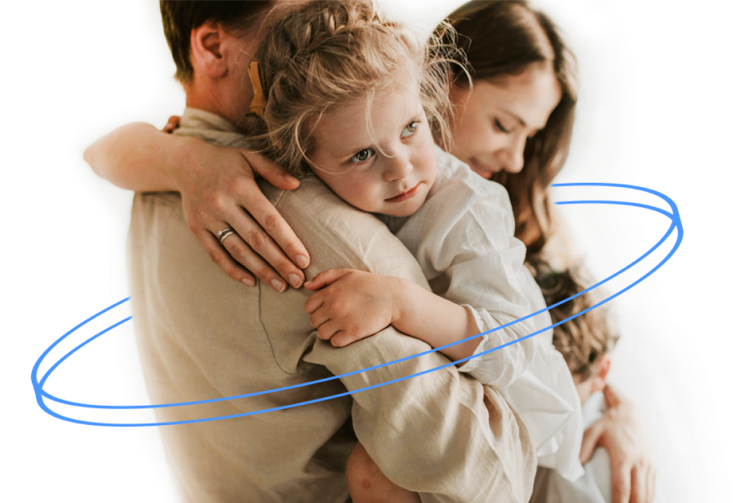 Father, mother, and daughter hugging and sharing love.